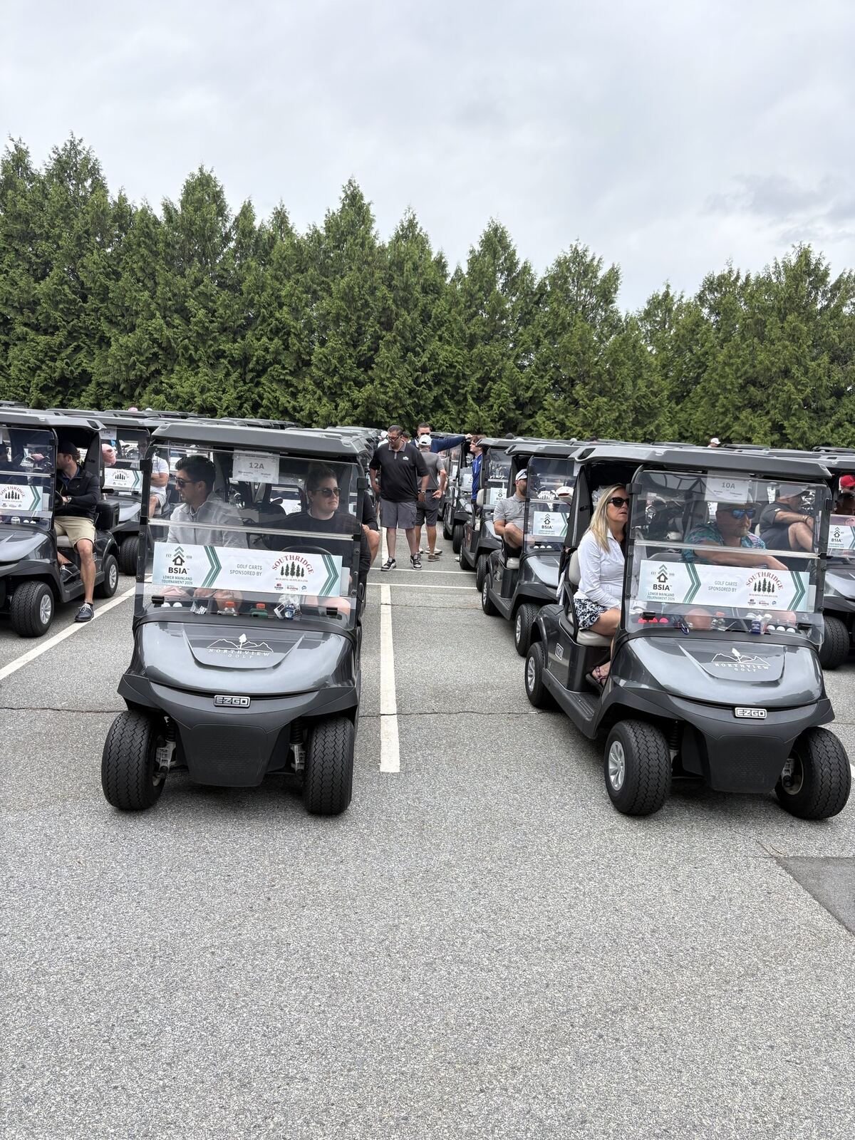 Rows of tournament golf carts lined up before the shotgun start